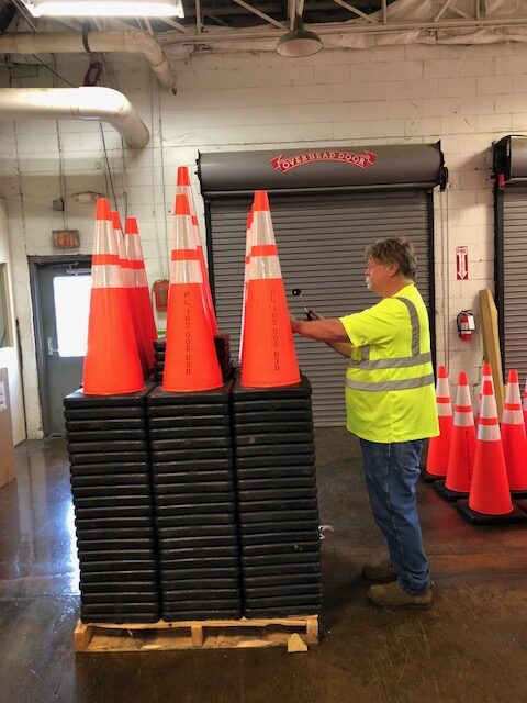 Applying stickers to safety cones